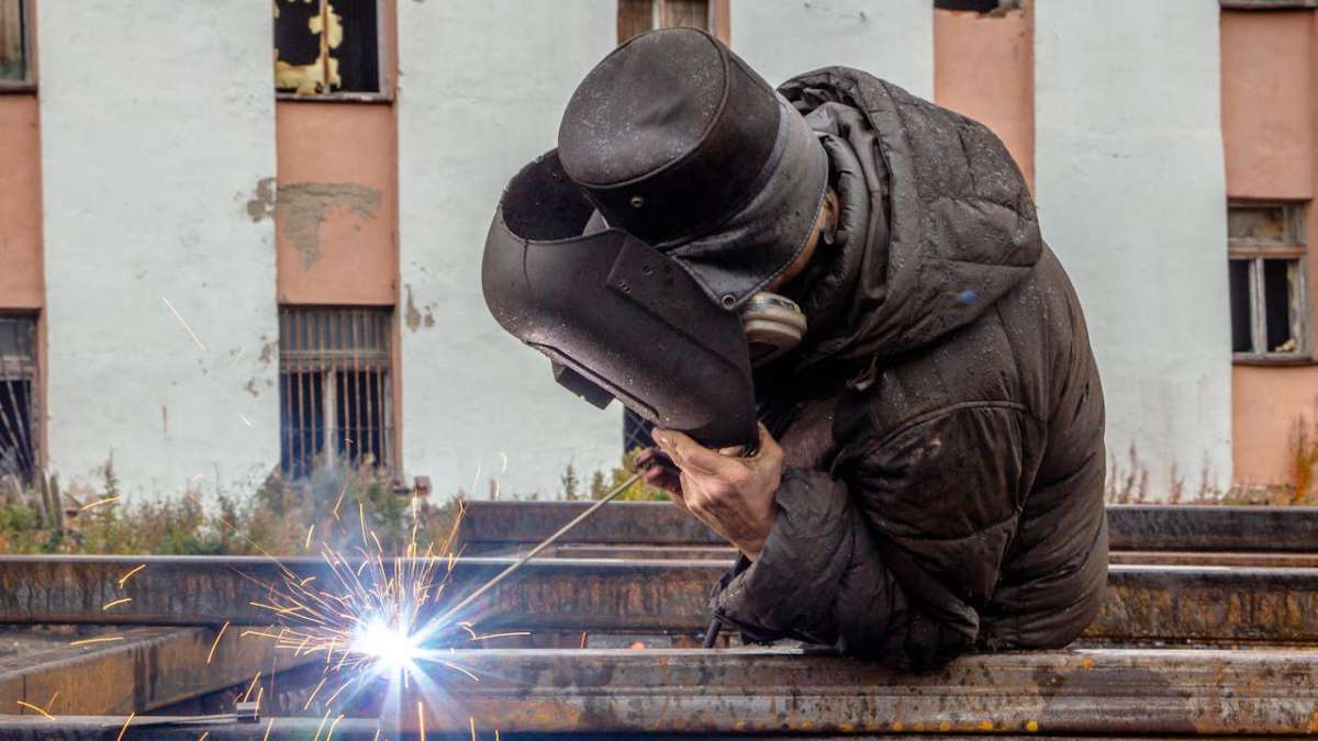 A worker welding metal